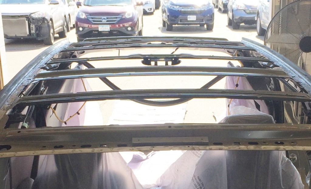 Vehicle roof bars awaiting new roof sheet metal install